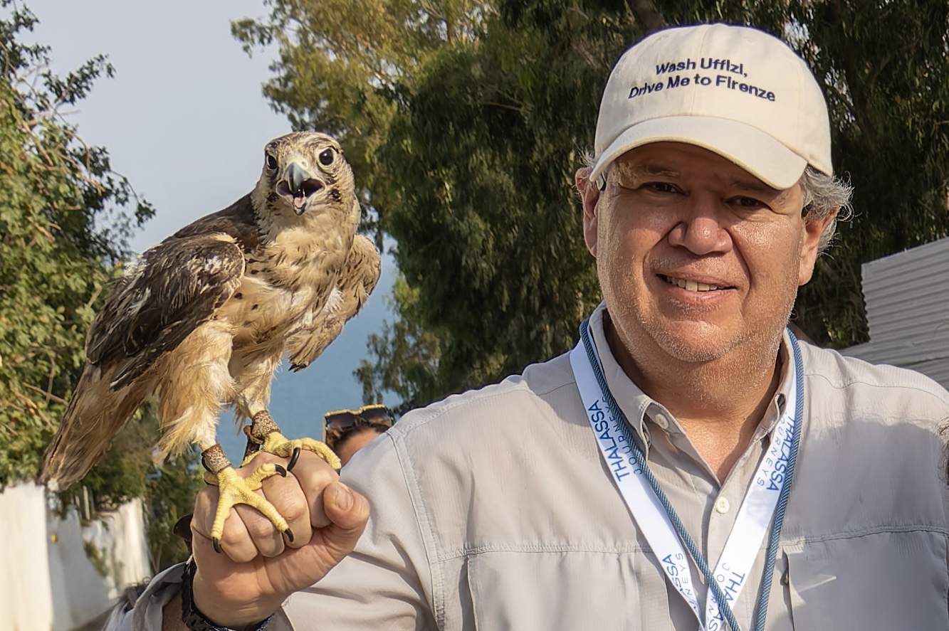 Josh Laronge holding a falcon in Sidi Bou Said, Tunisia